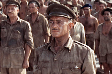 British POWs are ordered by their Japanese captors to construct a bridge of strategic importance and are happy to sabotage and delay the progress until their commanding officers orders them to continue the work unhindered to its completion, but are his actions tantamount to collaborating with the enemy?