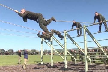 U.S. Marines with Charlie Co., 6th Engineer Support Battalion, 4th Marine Logistics Group participate in a Bottom Field Obstacle Course with British Army Commandos of 131 Independent Commando Squadron in Dartmoor, England.